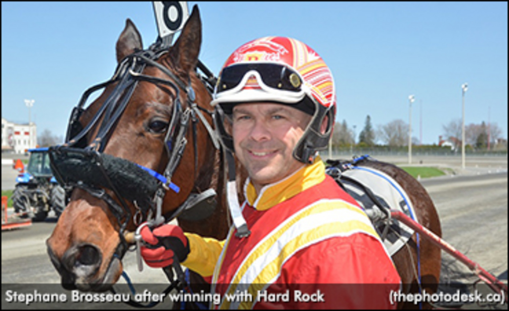 5-13-18 Stephane Brosseau is all smiles in the winners circle with Hard Rock, one of his five winners on the program.jpg