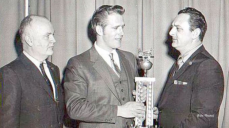 Bert Beckwith receiving a driving award in 1975
