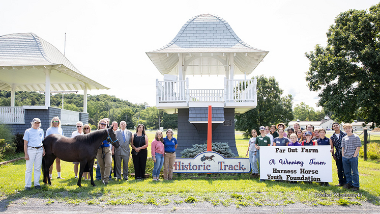 Harness Horse Youth Foundation receives a donation at Goshen Historic Track