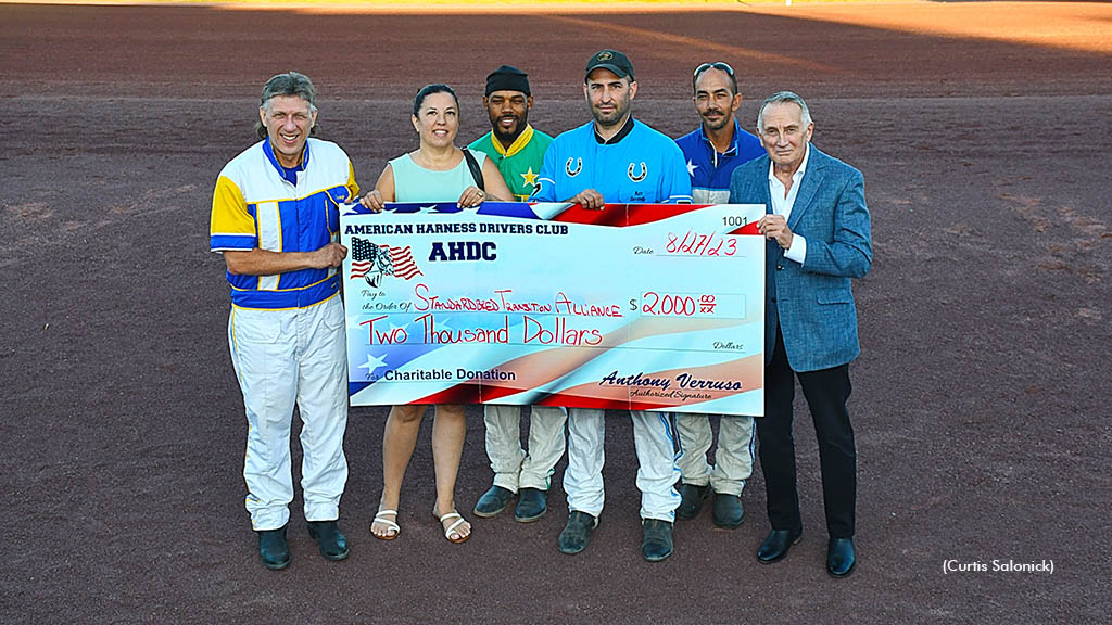The American Harness Driver's Club presents a donation to the Standardbred Transition Alliance