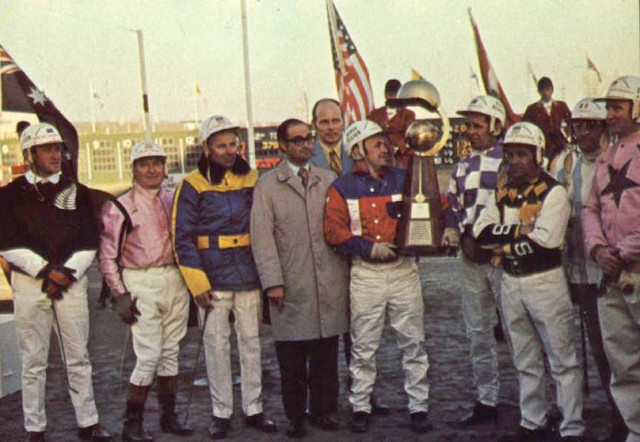 Herve Filion hoists the WDC trophy