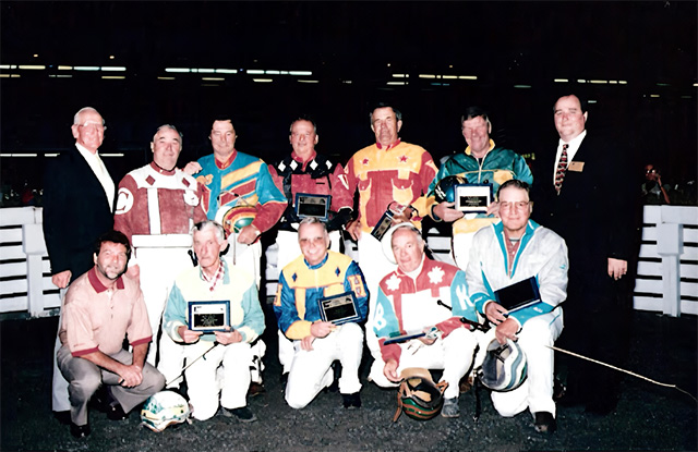 A group of drivers holding plaques