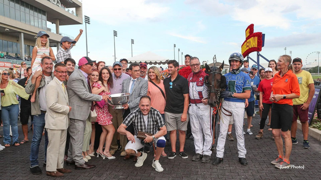 Hambletonian champion Cool Papa Bell and his connections in the Meadowlands winner's circle