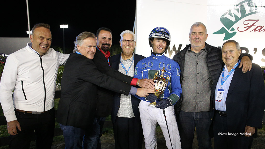 Joe Sbrocco (right) in the winner's circle after Pebble Beach won the North America Cup