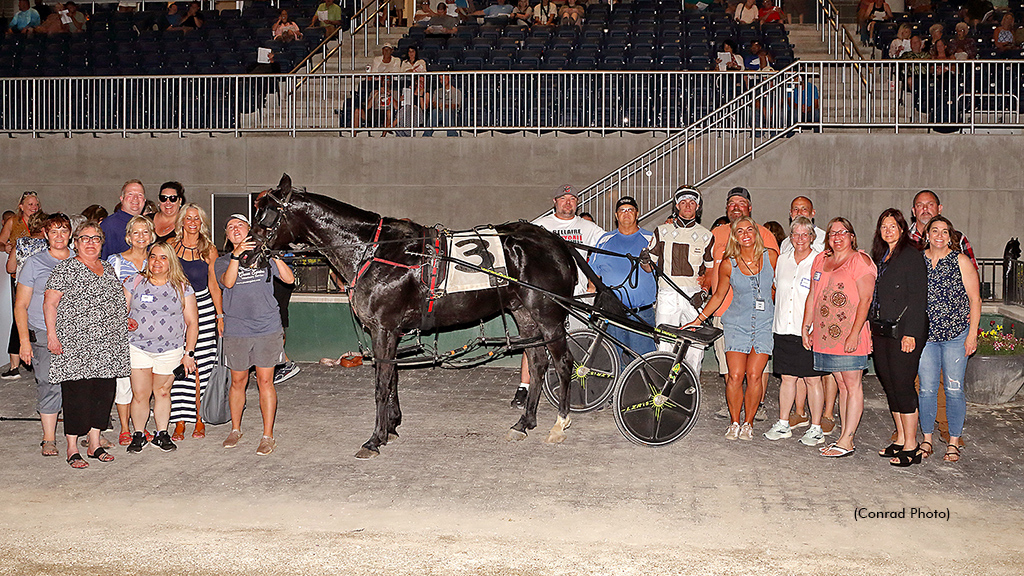 Rose Run Xiled in the Scioto Downs winner's circle, representing Haven House