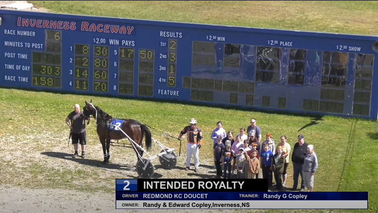 The connections of Intended Royalty in the winner's circle at Inverness Raceway