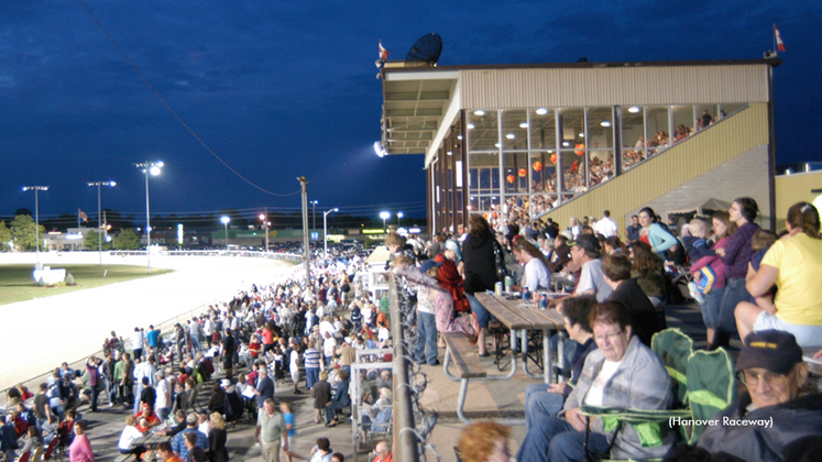 A view of Hanover Raceway with fans filling the grandstand